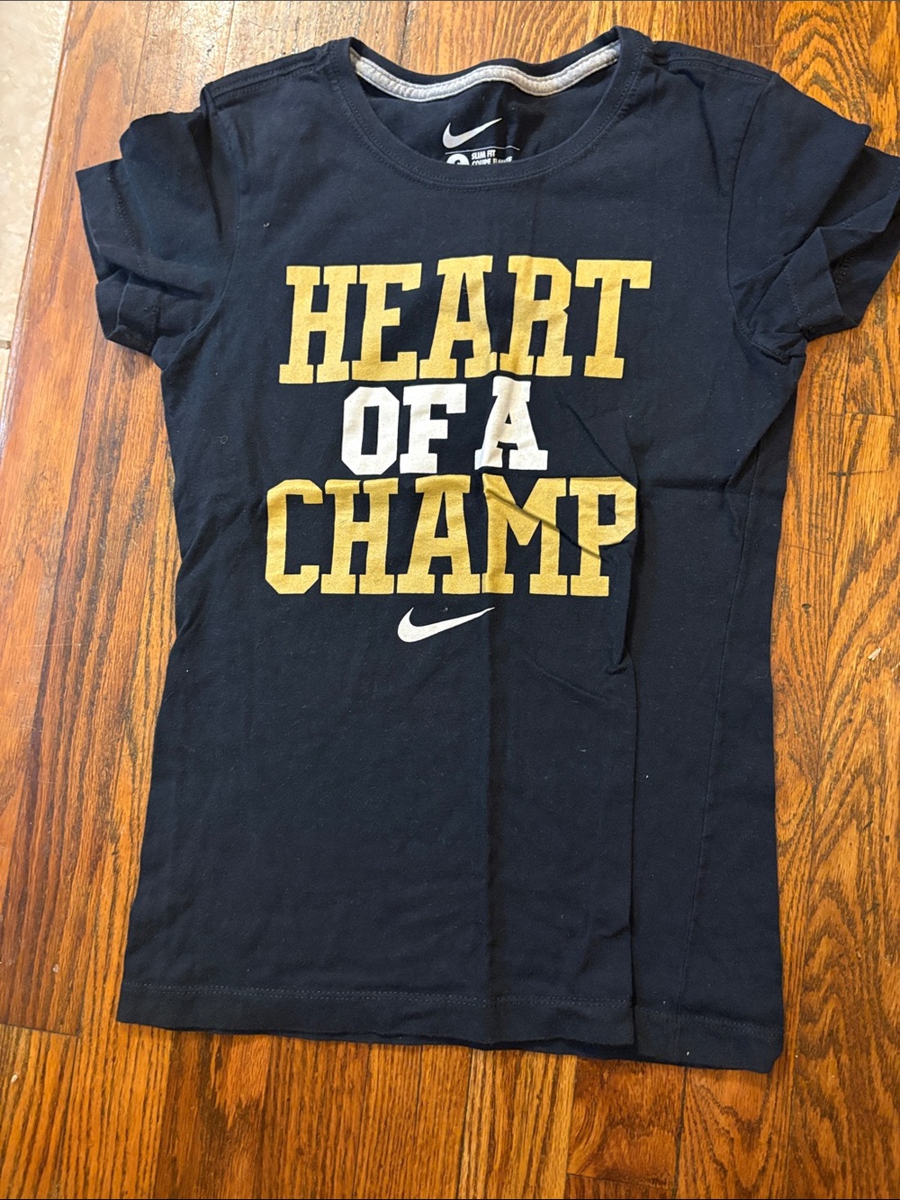 🎉Nike Black Short-Sleeve 'Heart of a Champ' Graphic Tee with Gold & White Print